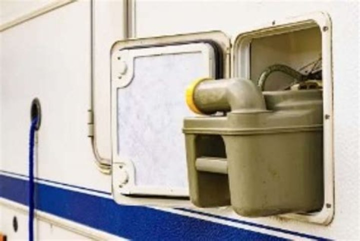 How do you clean a chemical toilet in a caravan?