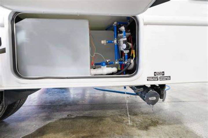 How do you drain a freshwater tank in a motorhome?
