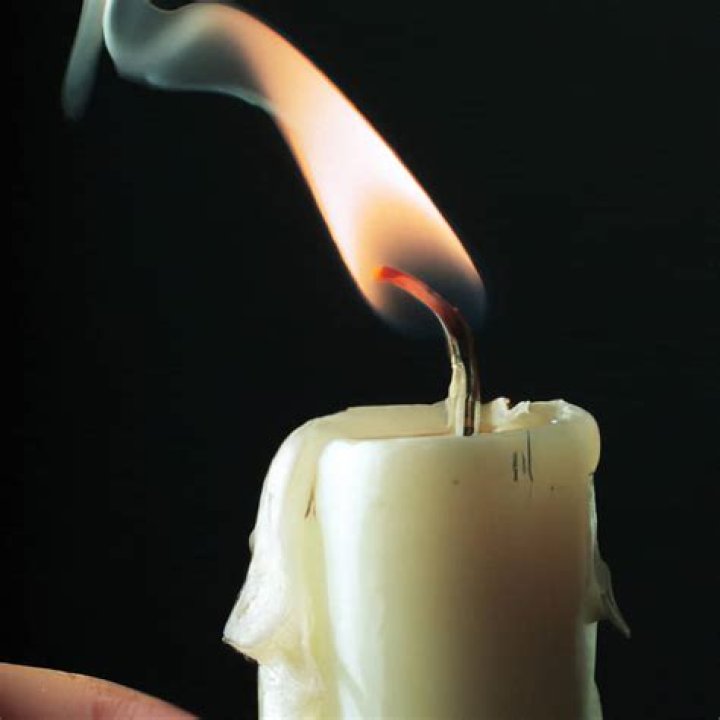 How do you keep a candle from blowing out?