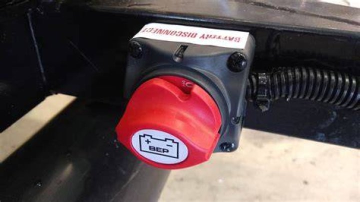 Should I disconnect my RV battery when plugged into shore power?