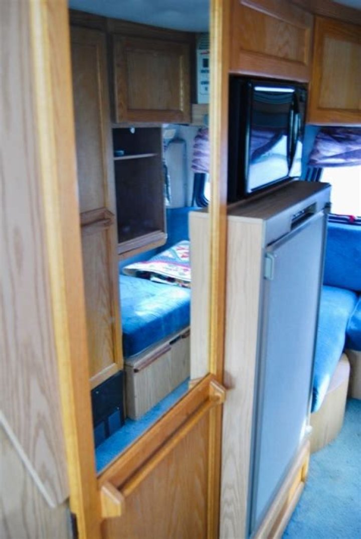 Where is the storage compartment on a Roadtrek 200?